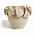 A light natural white speckled ceramic planter with a wide rim made of overlapping petal-like flaps, by Polly Barton Ceramics.