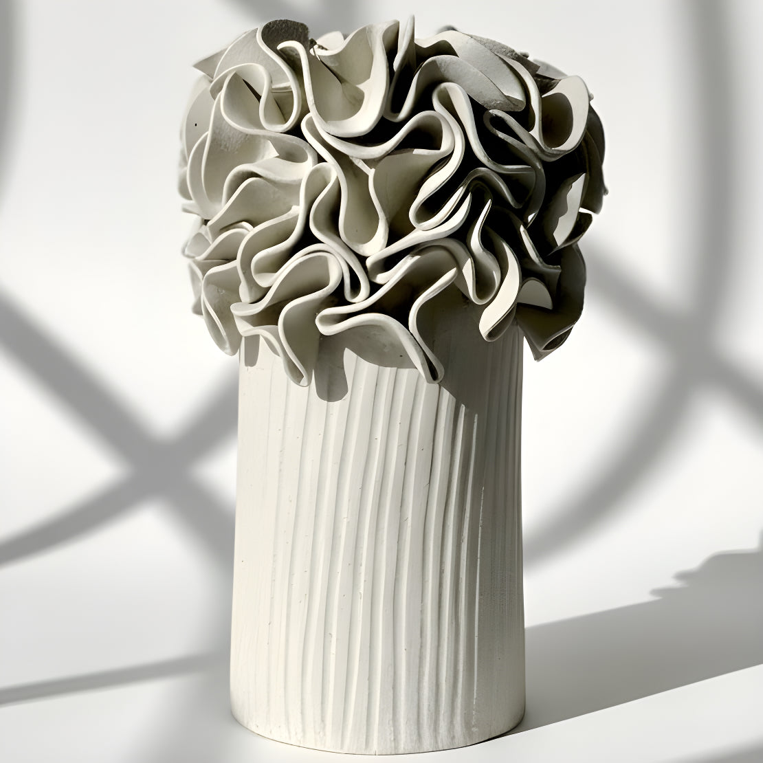White ceramic vase with textured ruffled design